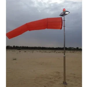 Solar-powered LED windsock with flashing light, red fabric, metal pole, desert background